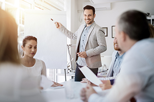 a team of professionals brainstorming on a sheet of paper