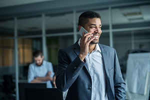 young business professional having a conversation over the phone