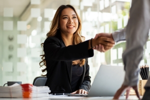 government contractor shaking hands over the negotiation of their protest